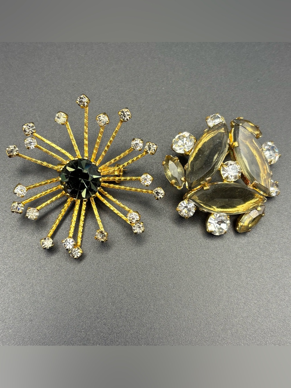 Vintage Gold-Tone Sunburst Brooch with Black Center and Clear Crystal Accents